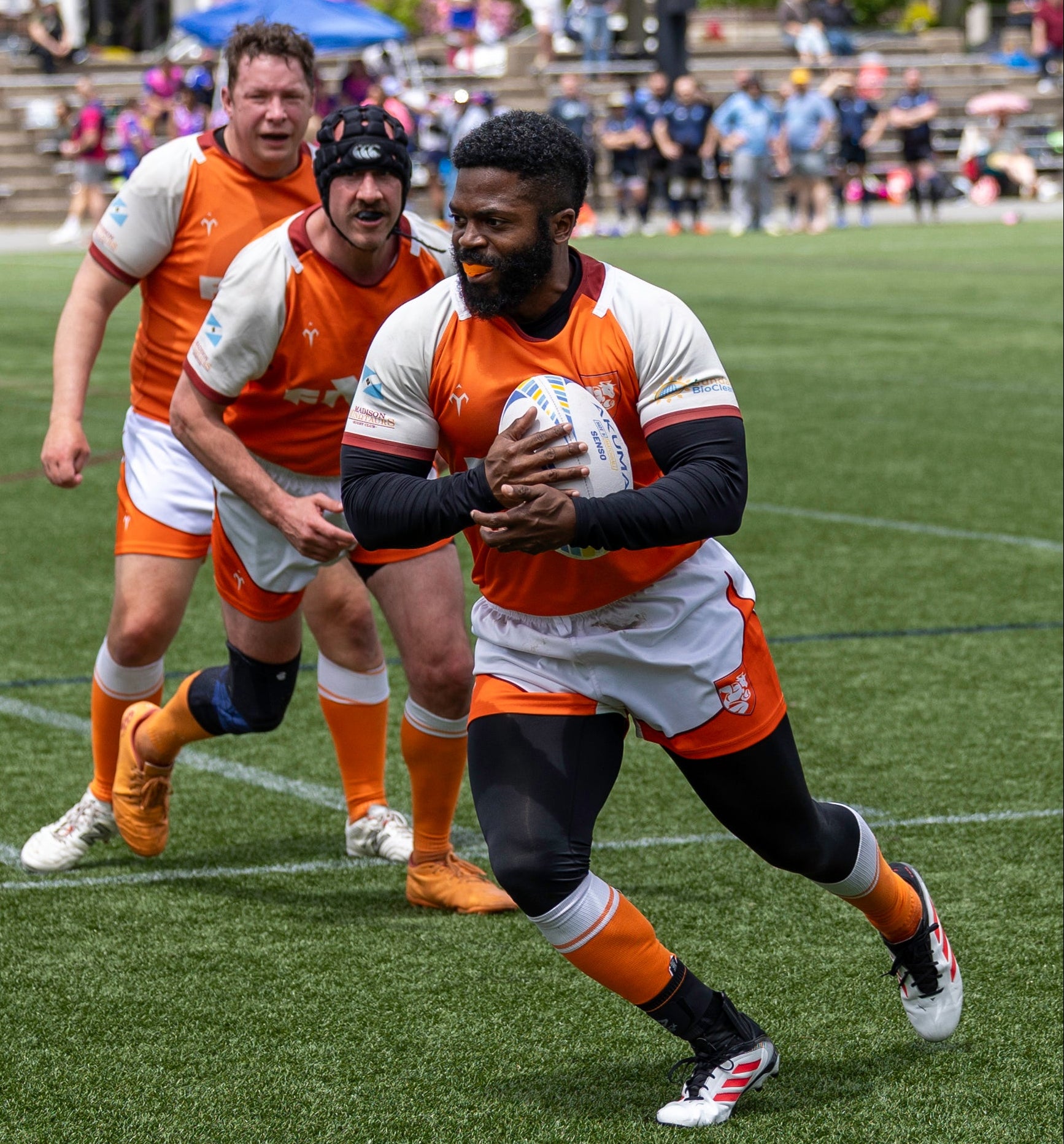 A rugby player running with the ball